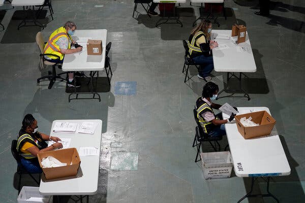 Workers preparing mail-in ballots in Raleigh, N.C., in September. The Supreme Court ruled Wednesday that absentee ballots could be counted up to nine days after Election Day. 